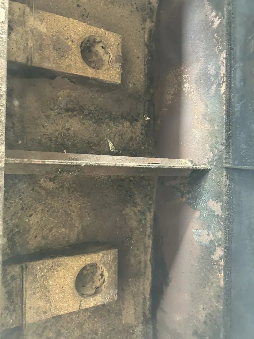 Dirty grill grates and interior before professional cleaning
